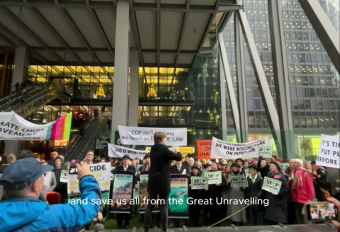 Climate Choir singing outside Lloyds Bank